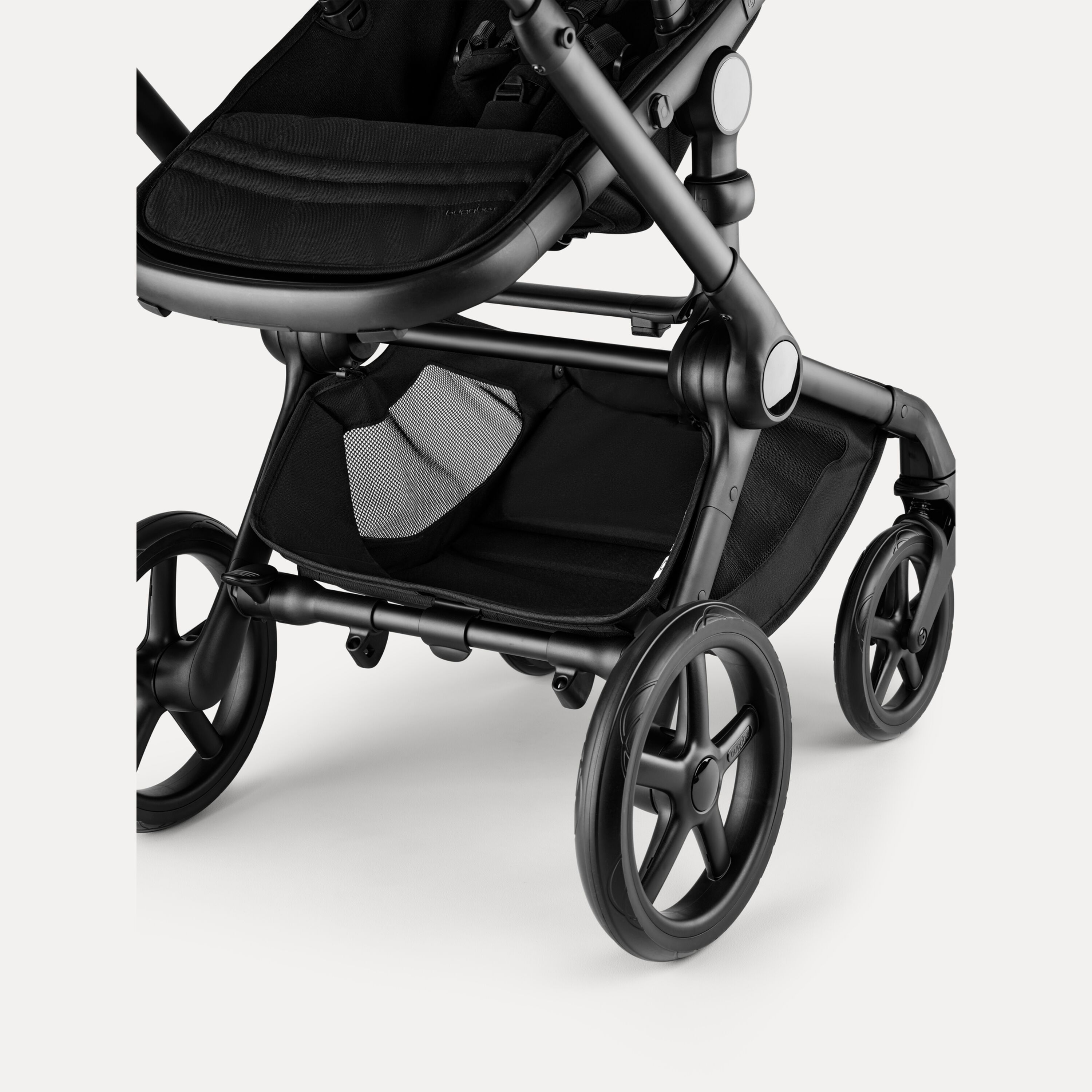 A closer look at the extra-large underseat basket and all-terrain wheels of the Bugaboo Fox 5 Renew stroller.  - Main Modal Image Slide 5 of 12