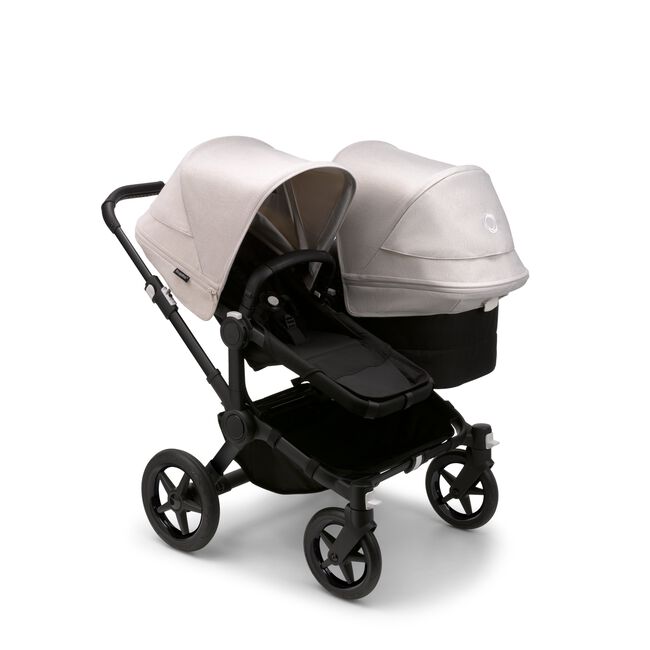 Bugaboo Donkey 5 Duo seat and bassinet stroller with black chassis, midnight black fabrics and misty white sun canopy. - Main Image Slide 1 of 12