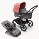Poussette siège et nacelle Bugaboo Fox 5 avec châssis noir, habillages gris chiné et capote rouge sunrise.