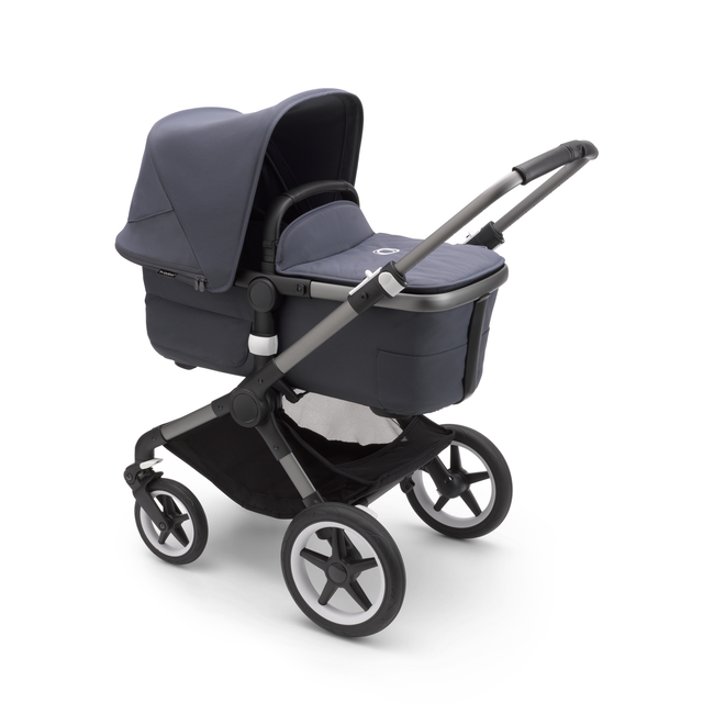 Bugaboo Fox 3 bassinet stroller with graphite frame, stormy blue fabrics, and stormy blue sun canopy.