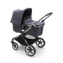 Bugaboo Fox 3 bassinet stroller with graphite frame, stormy blue fabrics, and stormy blue sun canopy. - Thumbnail Slide 2 of 9
