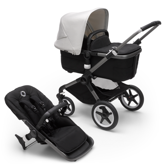 Bugaboo Fox 3 bassinet and seat stroller with graphite frame, black fabrics, and white sun canopy.