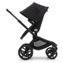 Side view of the Bugaboo Fox 5 seat stroller with black chassis, midnight black fabrics and midnight black sun canopy. - Thumbnail Modal Image Slide 4 of 15