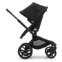 Side view of the Bugaboo Fox 5 seat stroller with black chassis, midnight black fabrics and midnight black sun canopy.