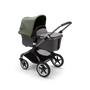 Bugaboo Fox 3 bassinet stroller with graphite frame, grey melange fabrics, and forest green sun canopy.