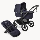 Bugaboo Fox 5 Renew bassinet and seat 2-in-1 stroller, with black chassis, Deep Indigo fabrics, and Deep Indigo sun canopy.