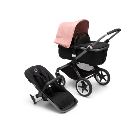 Bugaboo Fox 3 carrycot and seat pushchair with graphite frame, black fabrics, and pink sun canopy.