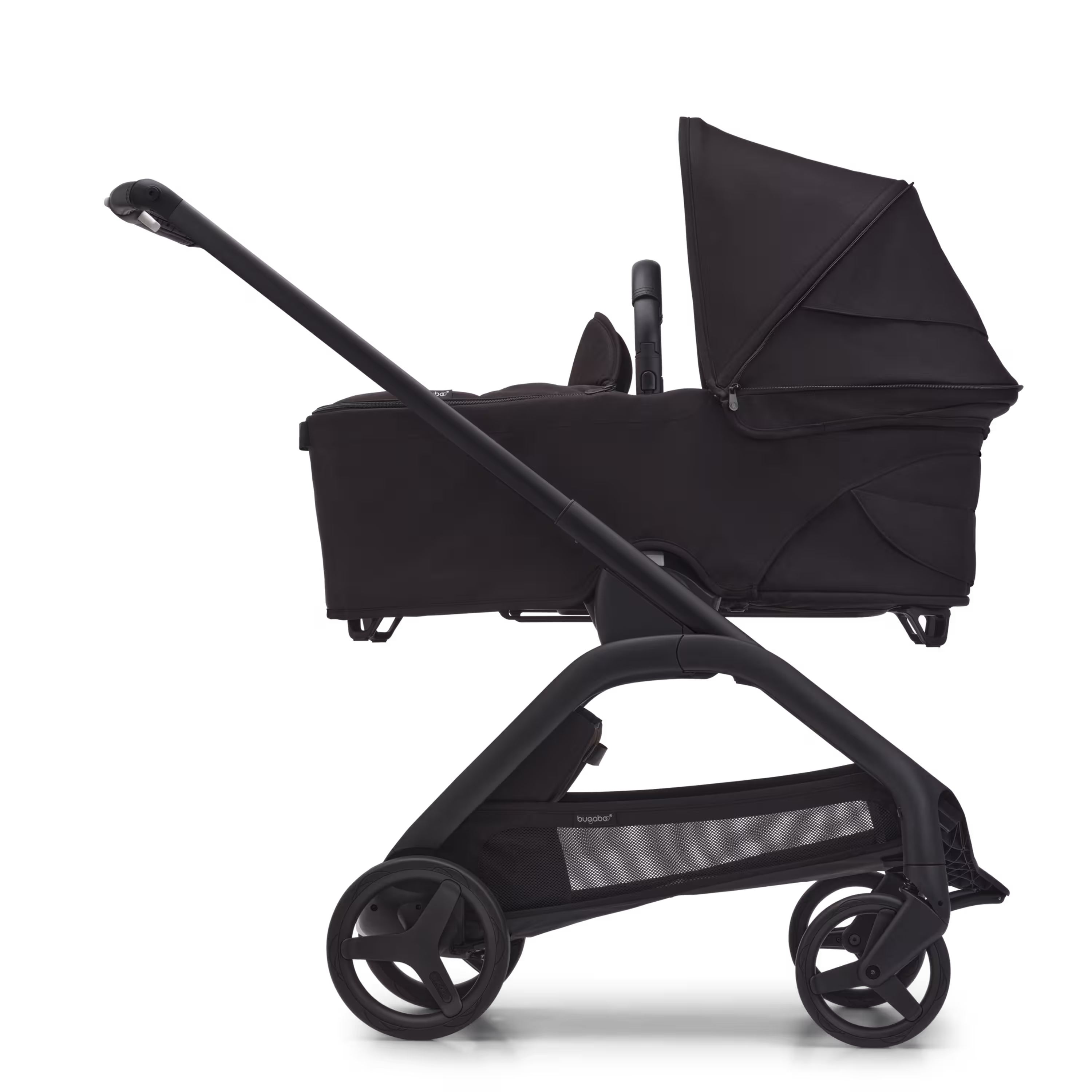 Side view of the Bugaboo Dragonfly carrycot pushchair with black chassis, midnight black fabrics and midnight black sun canopy. - Main Modal Image Slide 3 of 16