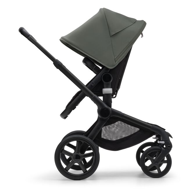 Side view of the Bugaboo Fox 5 seat stroller with black chassis, midnight black fabrics and forest green sun canopy. - Main Image Slide 4 of 16