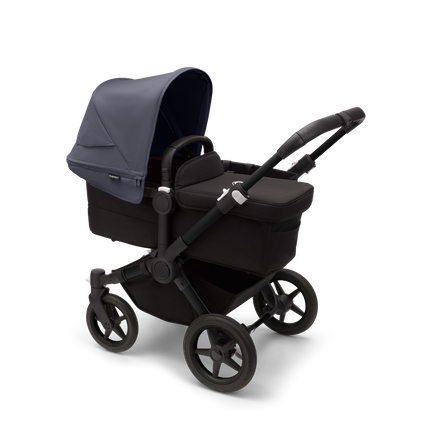 Bugaboo Donkey 5 Mono bassinet stroller with black chassis, midnight black fabrics and stormy blue sun canopy.