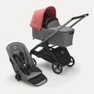 Poussette siège et nacelle Bugaboo Dragonfly avec châssis graphite, habillages gris chiné et capote rouge sunrise.