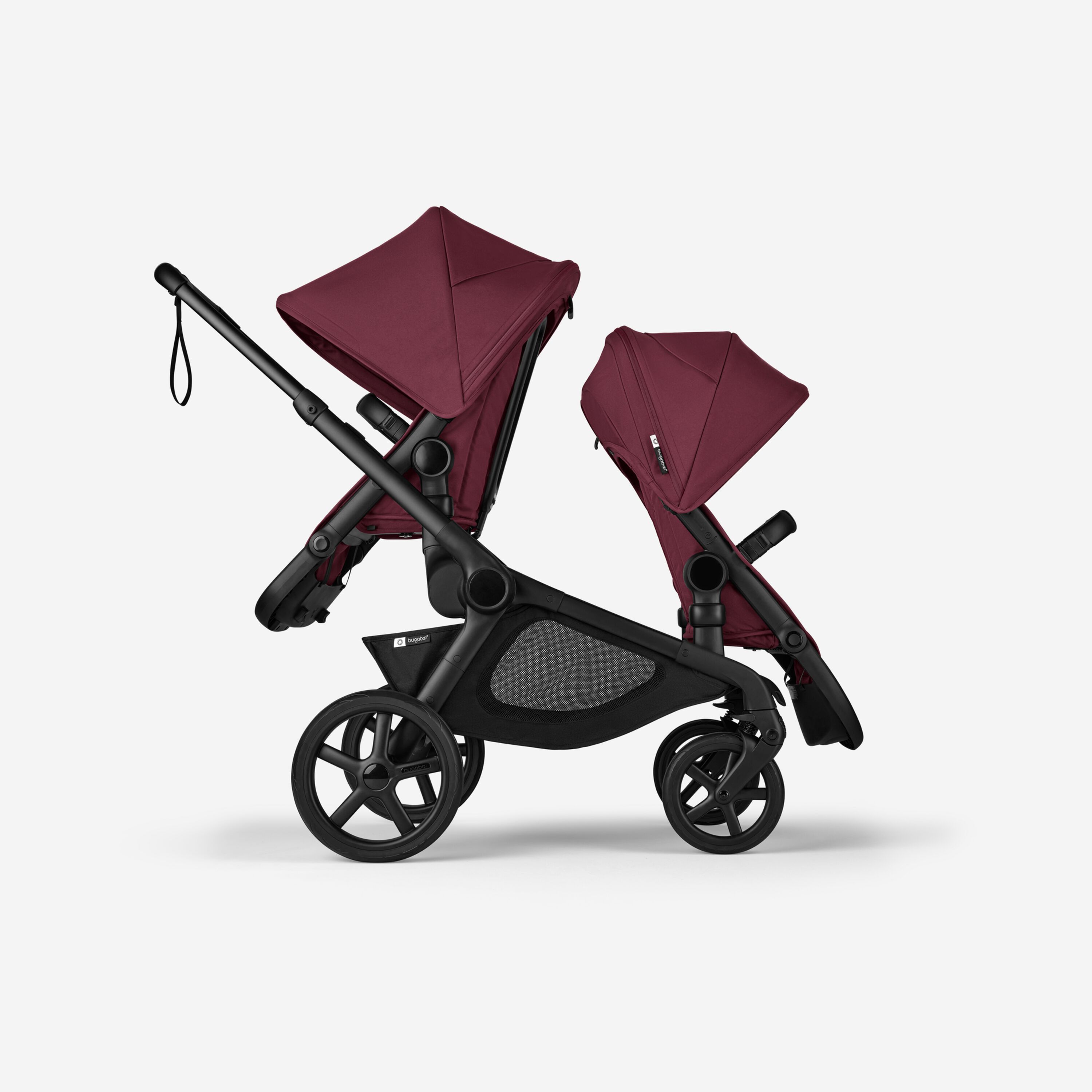 Side view of Bugaboo Kangaroo 2-in-1 tandem stroller with two seats, one facing parent and the other facing the world, with Dark Cherry fabrics and Dark Cherry sun canopies. - Main Modal Image Slide 4 of 18