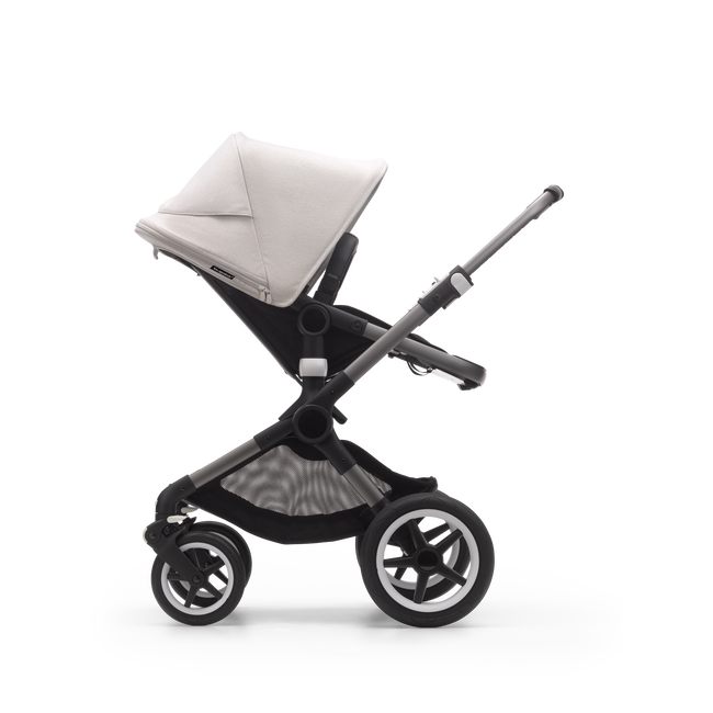 Side view of a Bugaboo Fox 3 seat stroller with graphite frame, black fabrics, and white sun canopy.