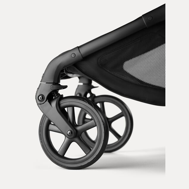 A close-up of the large, all-terrain rear wheels of the Bugaboo Fox 5 Renew stroller. - Main Image Slide 10 of 12