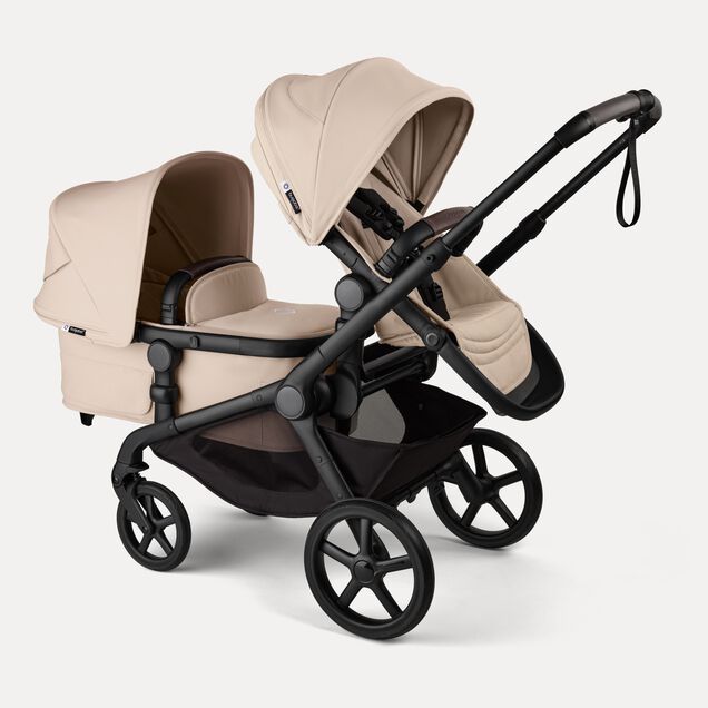 Bugaboo Kangaroo 2-in-1 tandem stroller with one seat above and one bassinet below, with Desert Taupe fabrics and Desert Taupe sun canopies. - Main Image Slide 3 of 18