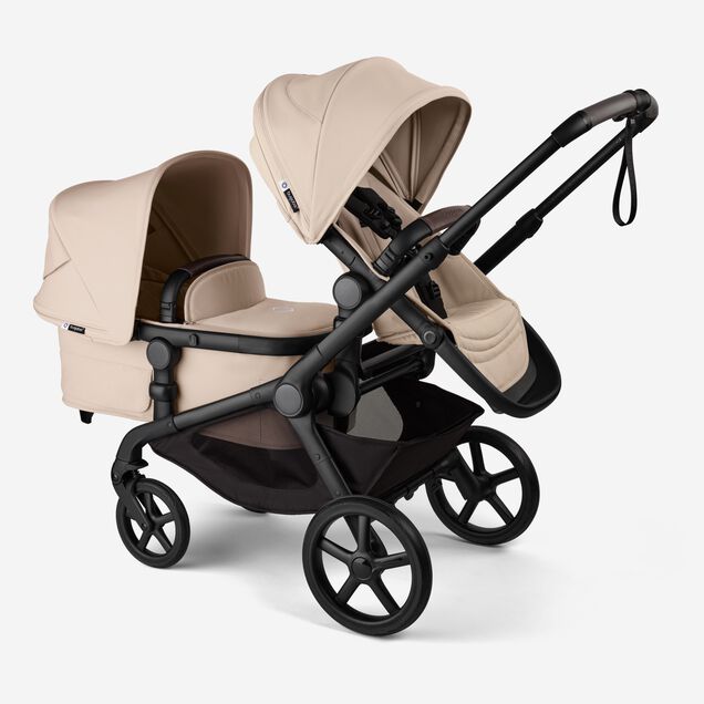 Bugaboo Kangaroo 2-in-1 tandem stroller with one seat above and one bassinet below, with Desert Taupe fabrics and Desert Taupe sun canopies. - Main Image Slide 3 of 18
