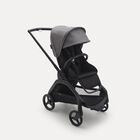 Carrito con silla Bugaboo Dragonfly con chasis negro, fundas negro medianoche y capota gris melange.