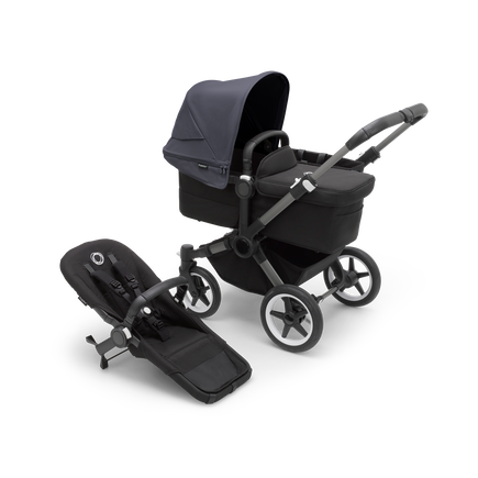 Bugaboo Donkey 5 Mono bassinet stroller with graphite chassis, midnight black fabrics and stormy blue sun canopy, plus seat.