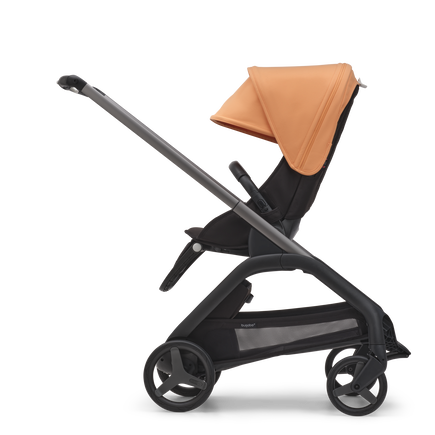 Side view of the Bugaboo Dragonfly seat stroller with graphite chassis, midnight black fabrics and island coral sun canopy. - view 2