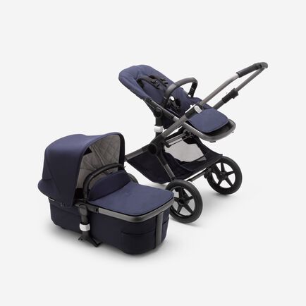 Bugaboo Fox 3 bassinet and seat stroller with graphite frame, dark navy fabrics, and dark navy sun canopy.