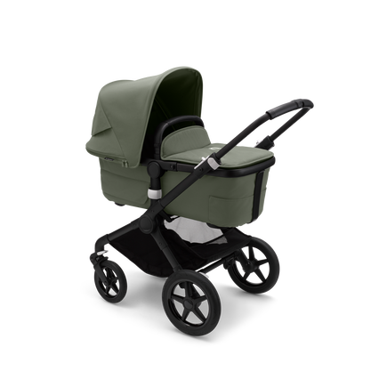 Bugaboo Fox 3 carrycot pushchair with black frame, forest green fabrics, and forest green sun canopy.