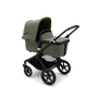 Bugaboo Fox 3 bassinet stroller with black frame, forest green fabrics, and forest green sun canopy.