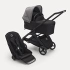 Bugaboo Dragonfly bassinet and seat stroller with black chassis, midnight black fabrics and grey melange sun canopy.
