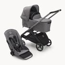 Carrito con silla y capazo Bugaboo Dragonfly con chasis grafito, fundas gris melange y capota gris melange.