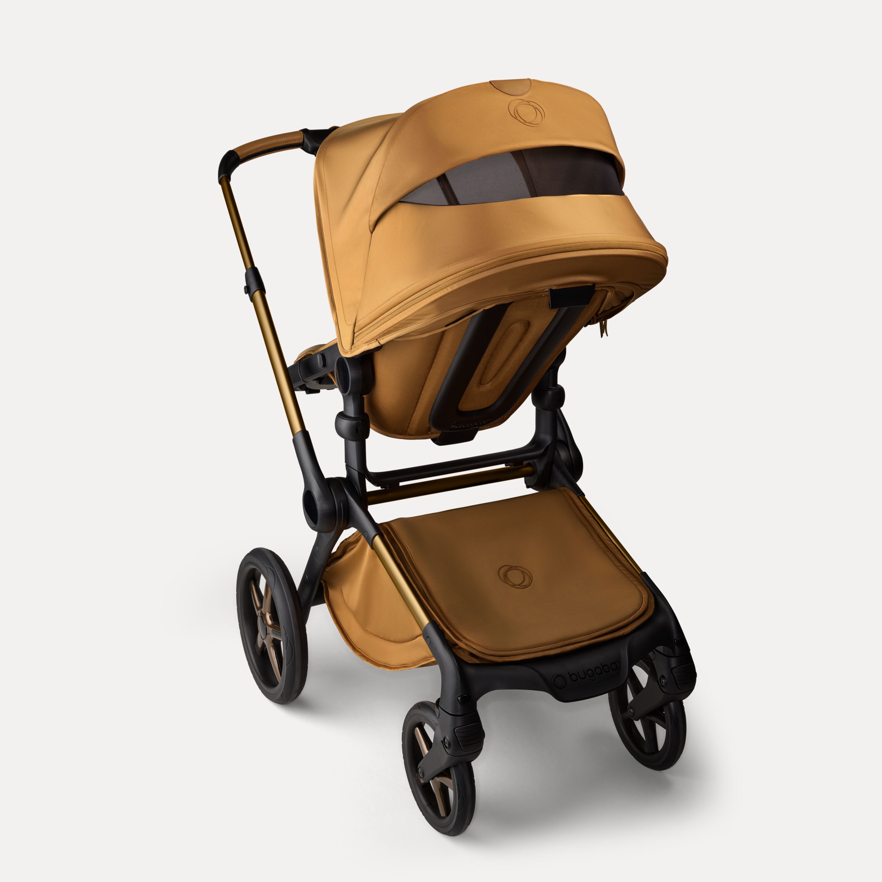 Back view of the Bugaboo Fox 5 Noir Limited Edition pushchair in Amber Glow, with the sun canopy's peek-a-boo panel visible. - Main Modal Image Slide 5 of 15