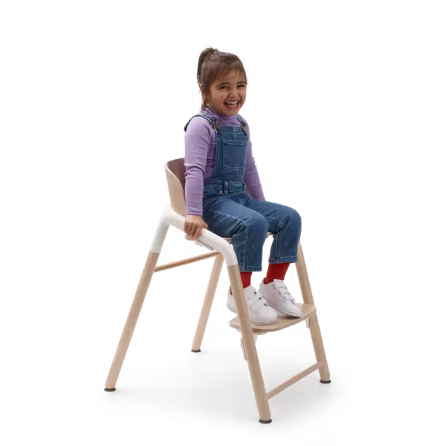 Child in a Bugaboo Giraffe chair. - Main Image Slide 8 of 9