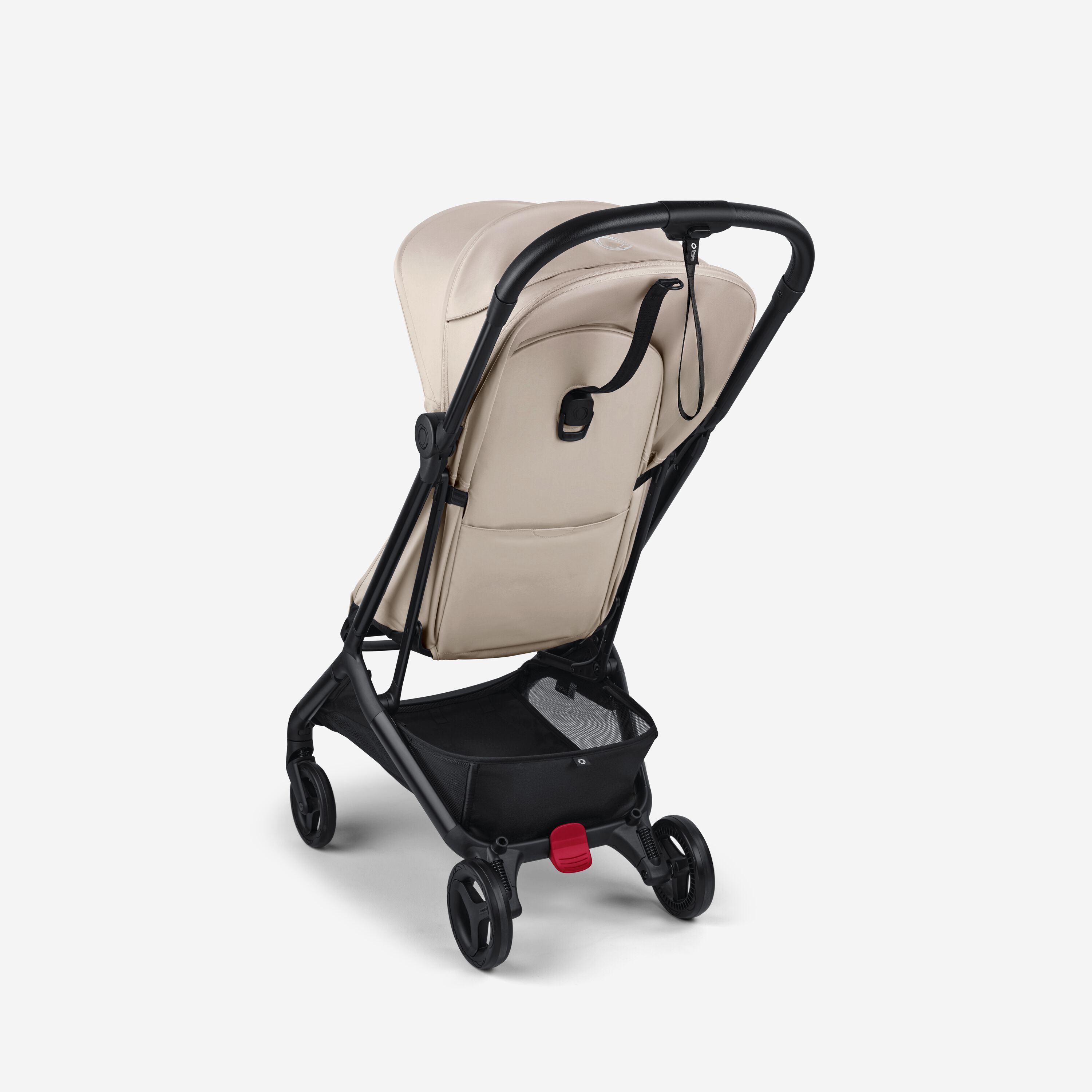 View from the back of a Bugaboo Butterfly 2 ultra-compact travel pram with black chassis, Desert Taupe fabrics, and Desert Taupe sun canopy. - Main Modal Image Slide 3 of 9