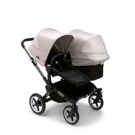 Bugaboo Donkey 5 Duo seat and bassinet stroller with graphite chassis, midnight black fabrics and misty white sun canopy.