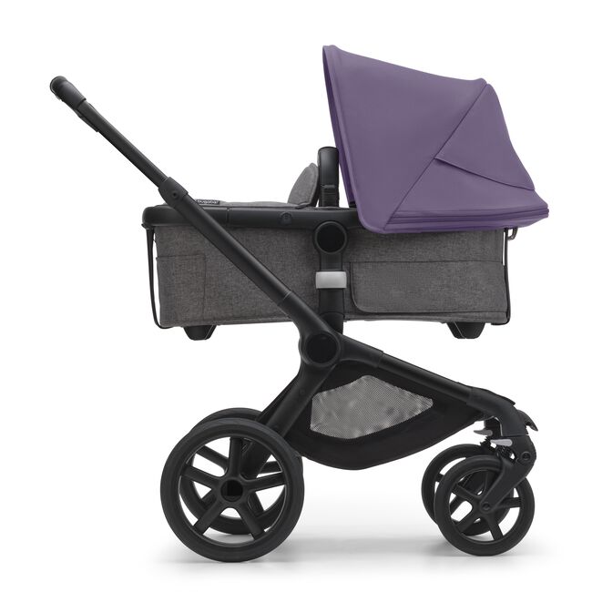 Side view of the Bugaboo Fox 5 bassinet stroller with black chassis, grey melange fabrics and astro purple sun canopy.