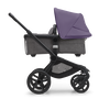 Side view of the Bugaboo Fox 5 bassinet stroller with black chassis, grey melange fabrics and astro purple sun canopy.