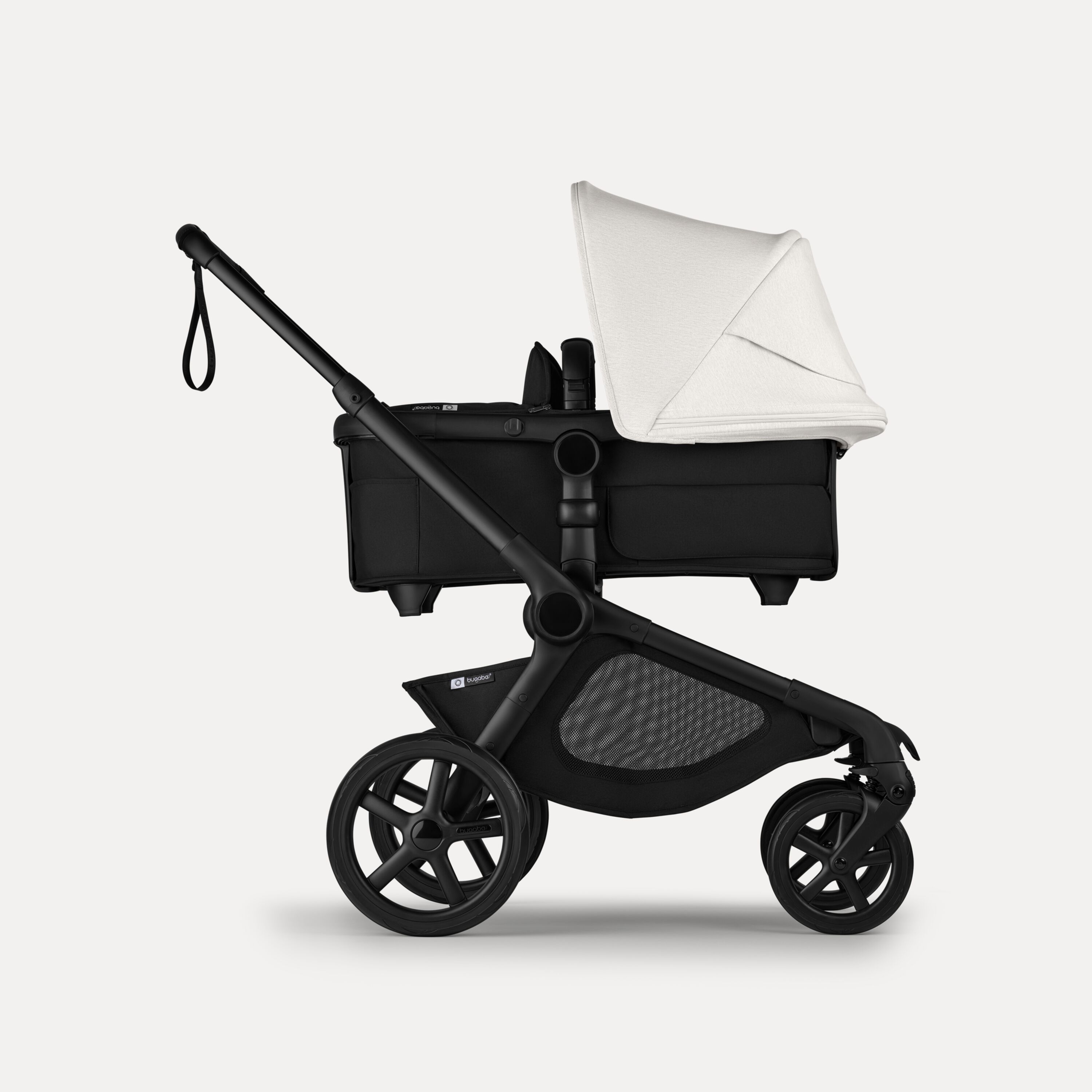 Side view of Bugaboo Kangaroo 2-in-1 stroller with one bassinet, Midnight Black fabrics, and Misty White sun canopy. - Main Modal Image Slide 2 of 18