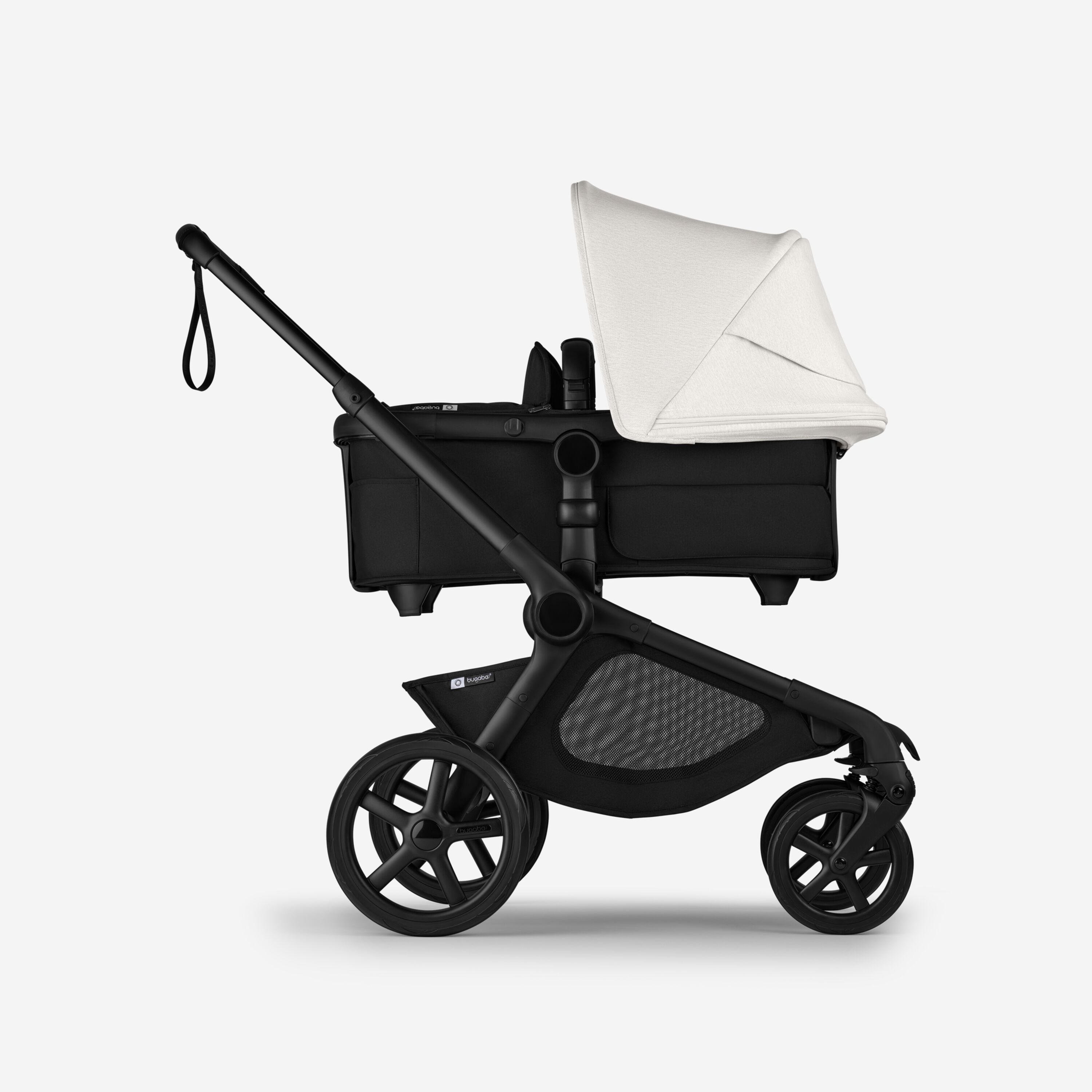 Side view of Bugaboo Kangaroo 2-in-1 stroller with one bassinet, Midnight Black fabrics, and Misty White sun canopy. - Main Modal Image Slide 2 of 18