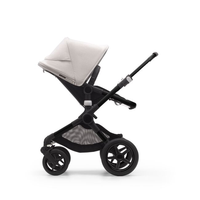 Side view of a Bugaboo Fox 3 seat stroller with black frame, black fabrics, and white sun canopy. - Main Image Slide 8 of 9