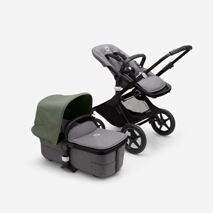 Bugaboo Fox 3 bassinet and seat stroller with black frame, grey melange fabrics, and forest green sun canopy.