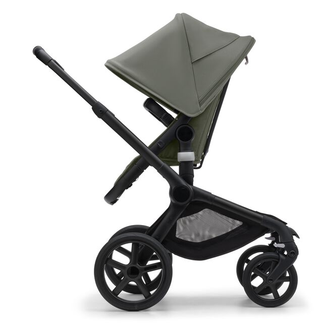 Side view of the Bugaboo Fox 5 seat stroller with black chassis, forest green fabrics and forest green sun canopy.