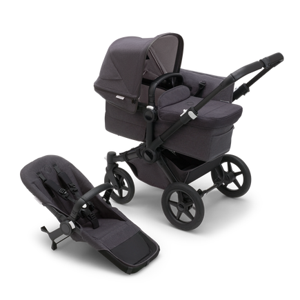 Bugaboo Donkey 5 Mono bassinet stroller with black chassis, mineral washed black fabrics and mineral washed black sun canopy, plus seat.