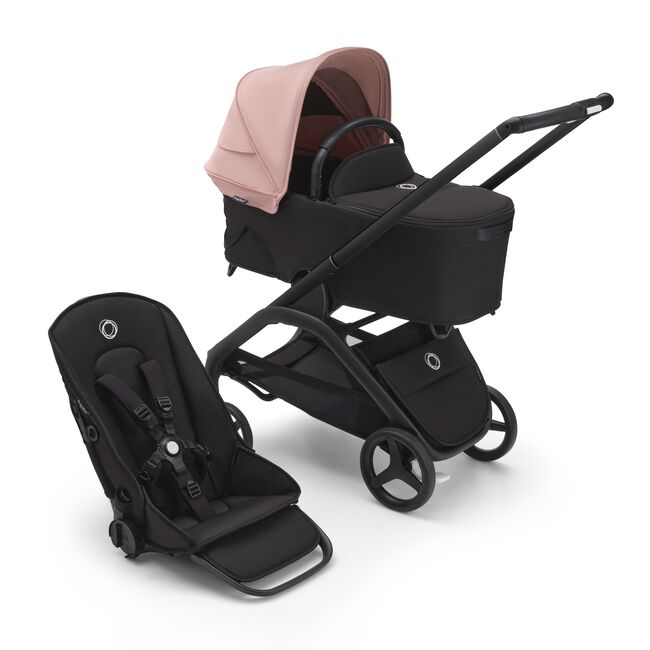 Bugaboo Dragonfly bassinet and seat stroller with black chassis, midnight black fabrics and morning pink sun canopy. - Main Image Slide 2 of 3