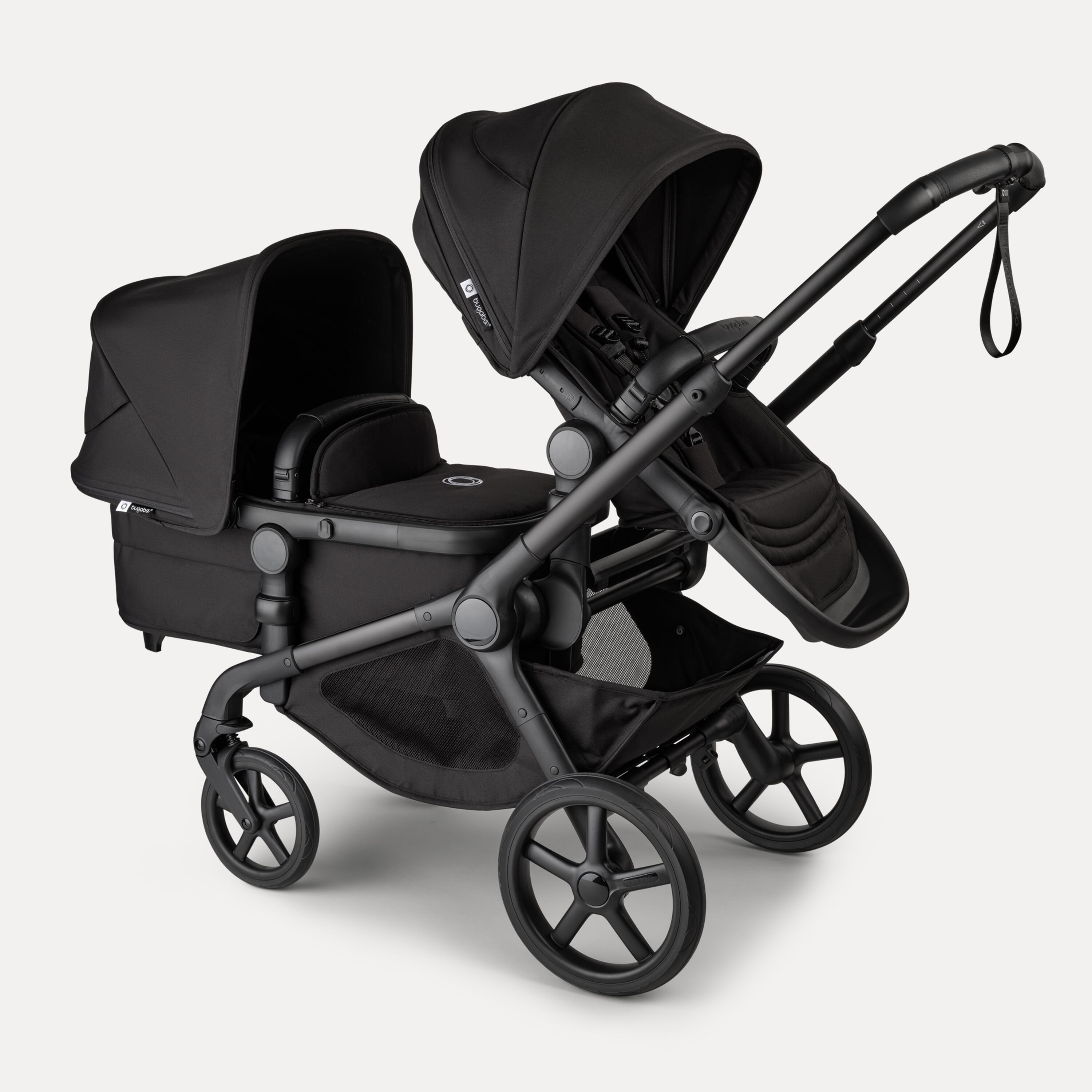Bugaboo Kangaroo 2-in-1 tandem stroller with one seat above and one bassinet below, with Midnight Black fabrics and Midnight Black sun canopies. - Main Modal Image Slide 3 of 18