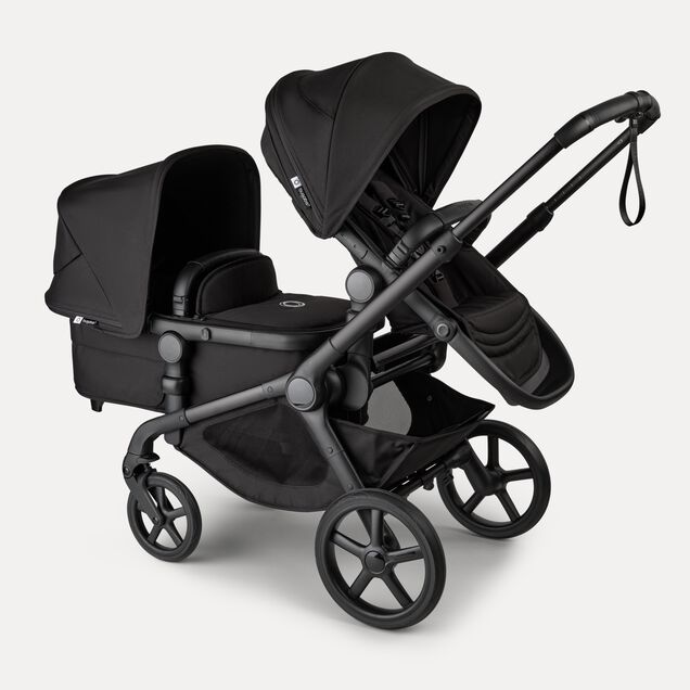 Bugaboo Kangaroo 2-in-1 tandem stroller with one seat above and one bassinet below, with Midnight Black fabrics and Midnight Black sun canopies. - Main Image Slide 3 of 18
