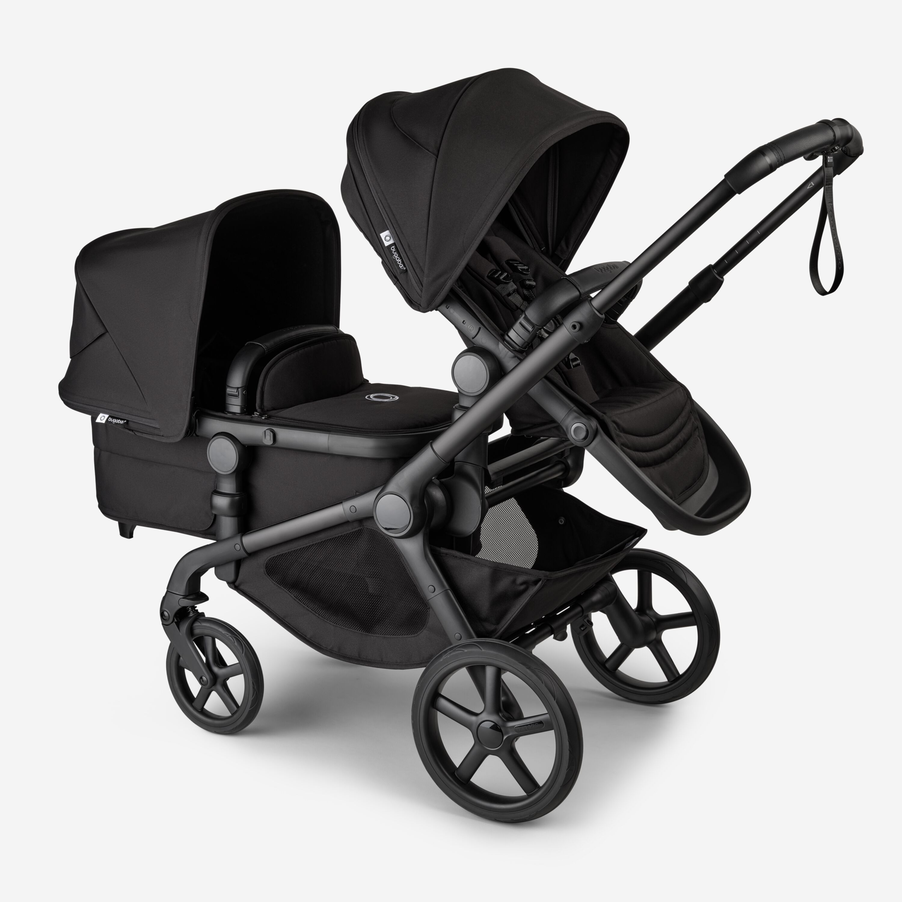 Bugaboo Kangaroo 2-in-1 tandem stroller with one seat above and one bassinet below, with Midnight Black fabrics and Midnight Black sun canopies. - Main Modal Image Slide 3 of 18