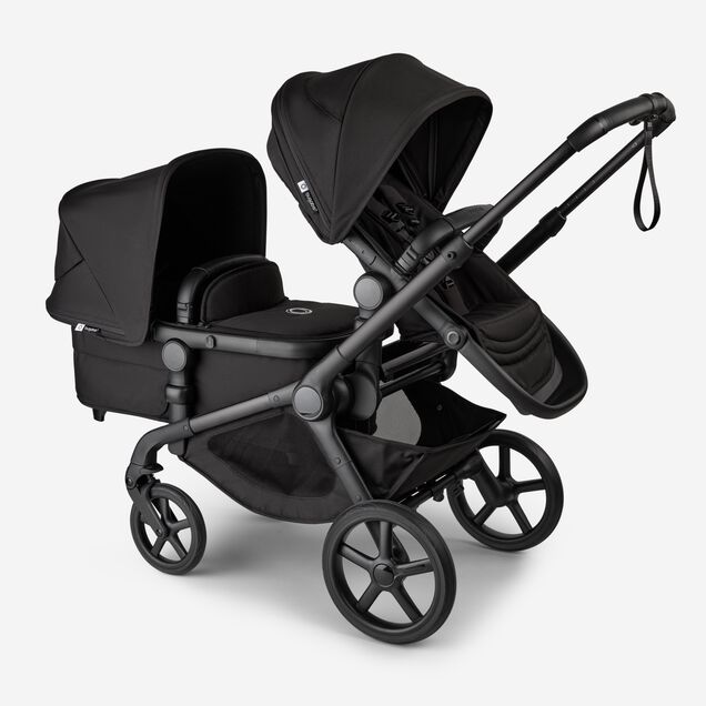 Bugaboo Kangaroo 2-in-1 tandem stroller with one seat above and one bassinet below, with Midnight Black fabrics and Midnight Black sun canopies. - Main Image Slide 3 of 18