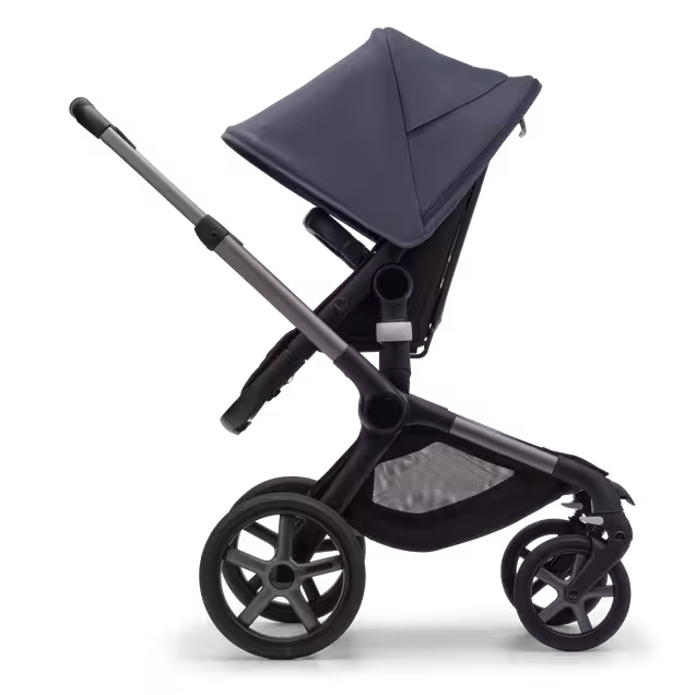 Side view of the Bugaboo Fox 5 seat pushchair with graphite chassis, midnight black fabrics and stormy blue sun canopy. - Main Image Slide 3 of 13