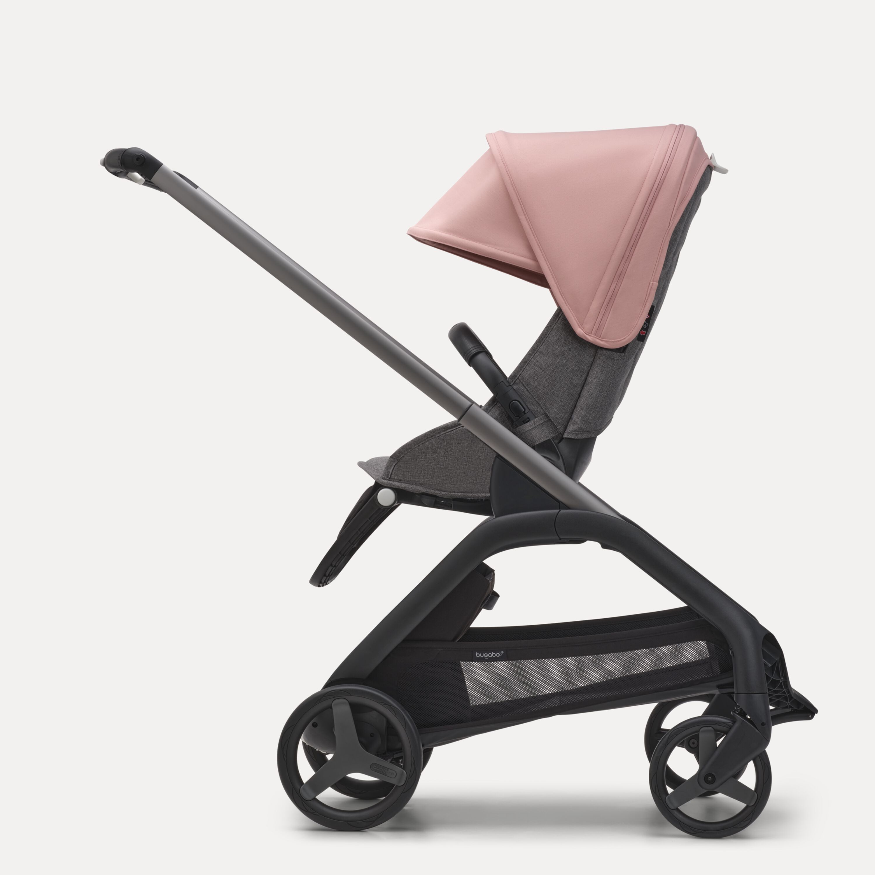 Side view of the Bugaboo Dragonfly seat stroller with graphite chassis, grey melange fabrics and morning pink sun canopy. - Main Modal Image Slide 2 of 16