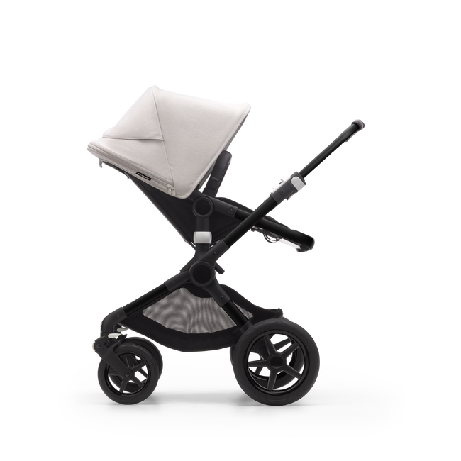 Side view of a Bugaboo Fox 3 seat stroller with black frame, black fabrics, and white sun canopy.