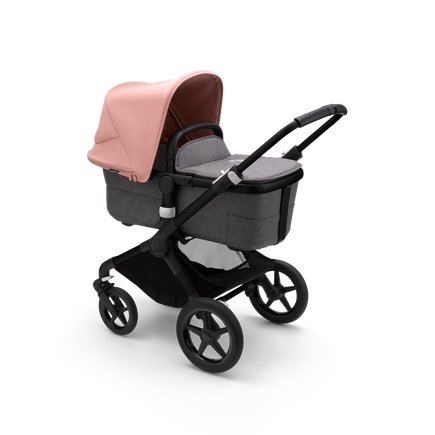 Bugaboo Fox 3 carrycot pushchair with black frame, grey fabrics, and pink sun canopy.