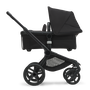 Side view of the Bugaboo Fox 5 carrycot pushchair with black chassis, midnight black fabrics and midnight black sun canopy. - Thumbnail Modal Image Slide 3 of 16